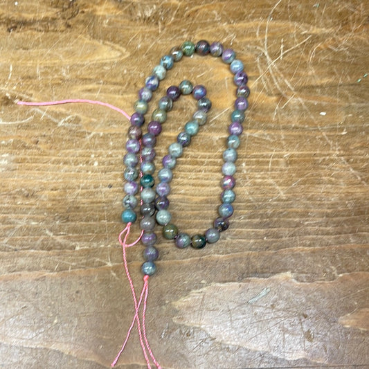 15 inch 6mm ruby and kyanite bead strand